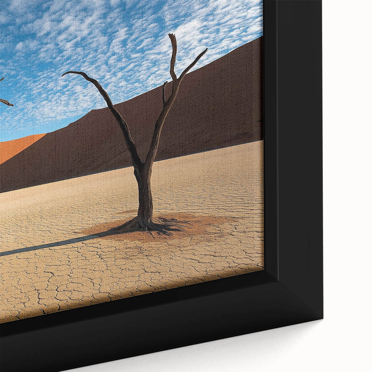 Close-up of a framed canvas artwork showcasing a vibrant desert landscape with rich colors and intricate details, perfect for home decor enthusiasts.