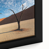 Close-up of a framed canvas artwork showcasing a vibrant desert landscape with rich colors and intricate details, perfect for home decor enthusiasts.