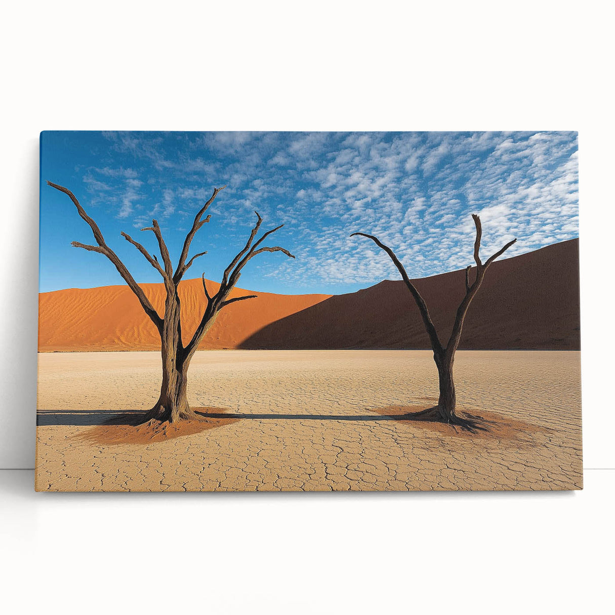 Desert landscape stretched canvas art piece featuring warm hues of orange and yellow, depicting rolling dunes under a clear blue sky, perfect for modern home decor.