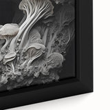 Close-up of textured black wall art with colorful abstract elements on a framed canvas, suitable for a spacious living room.