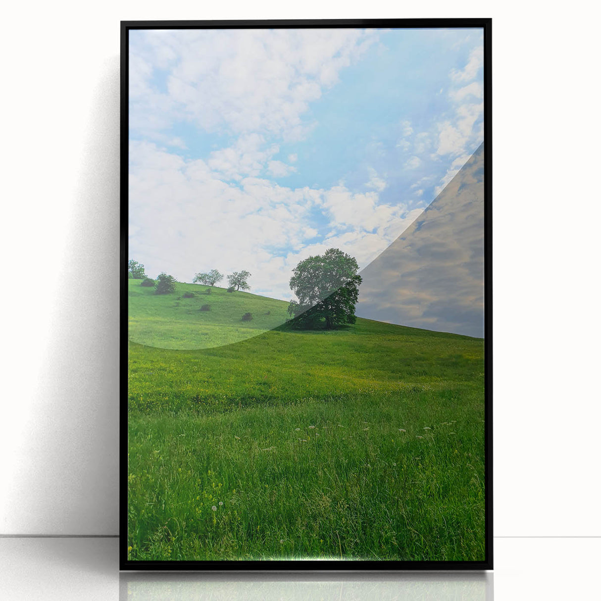 Large abstract wall art depicting spring themes in soft green and yellow tones on a black framed acrylic.