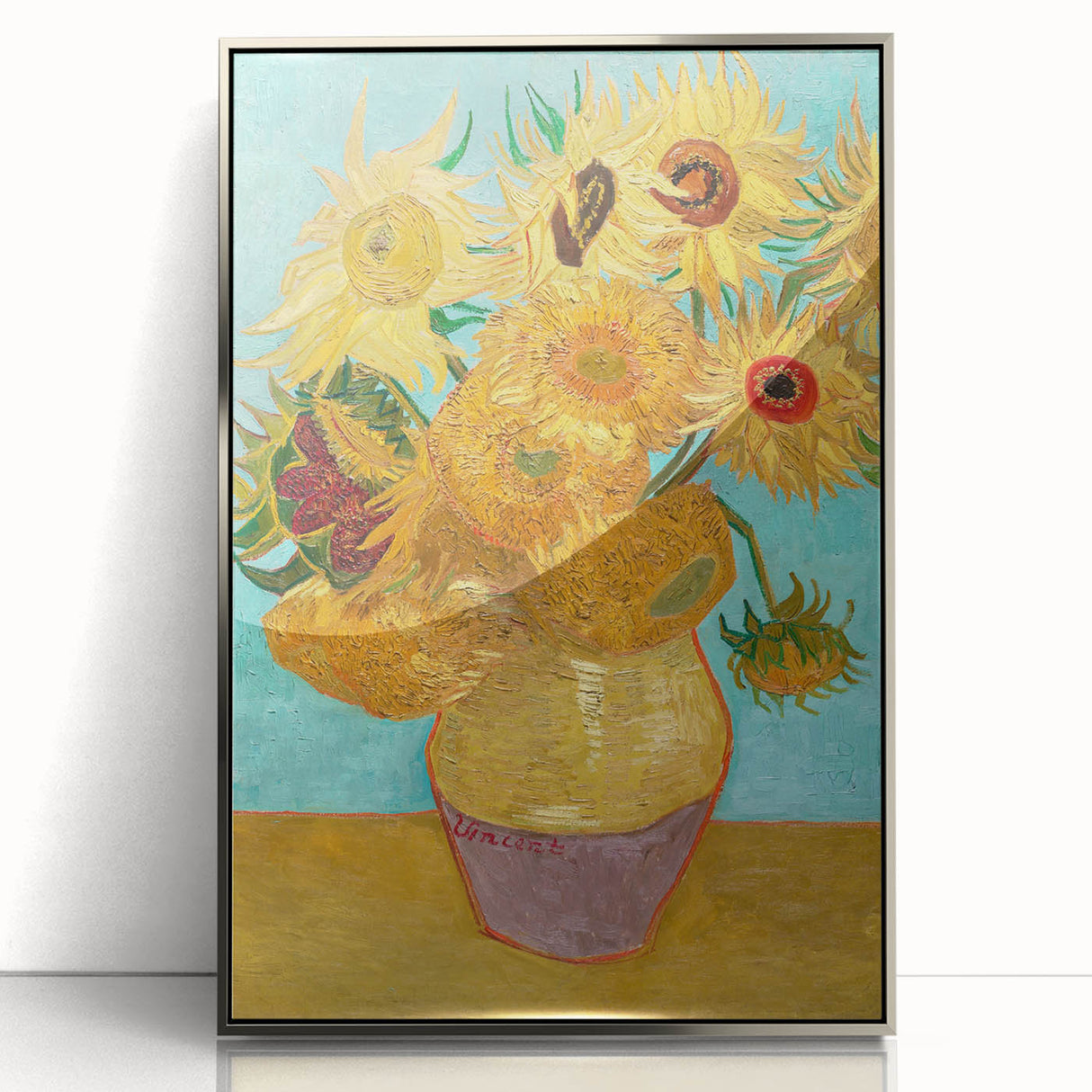 Large art print of a Van Gogh painting in silver frame, featuring vibrant blue and yellow tones.