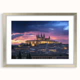 Elegant silver-framed landscape artwork showcasing a majestic castle surrounded by lush greenery, complemented by a white mat. Perfect for home decor or gallery display.