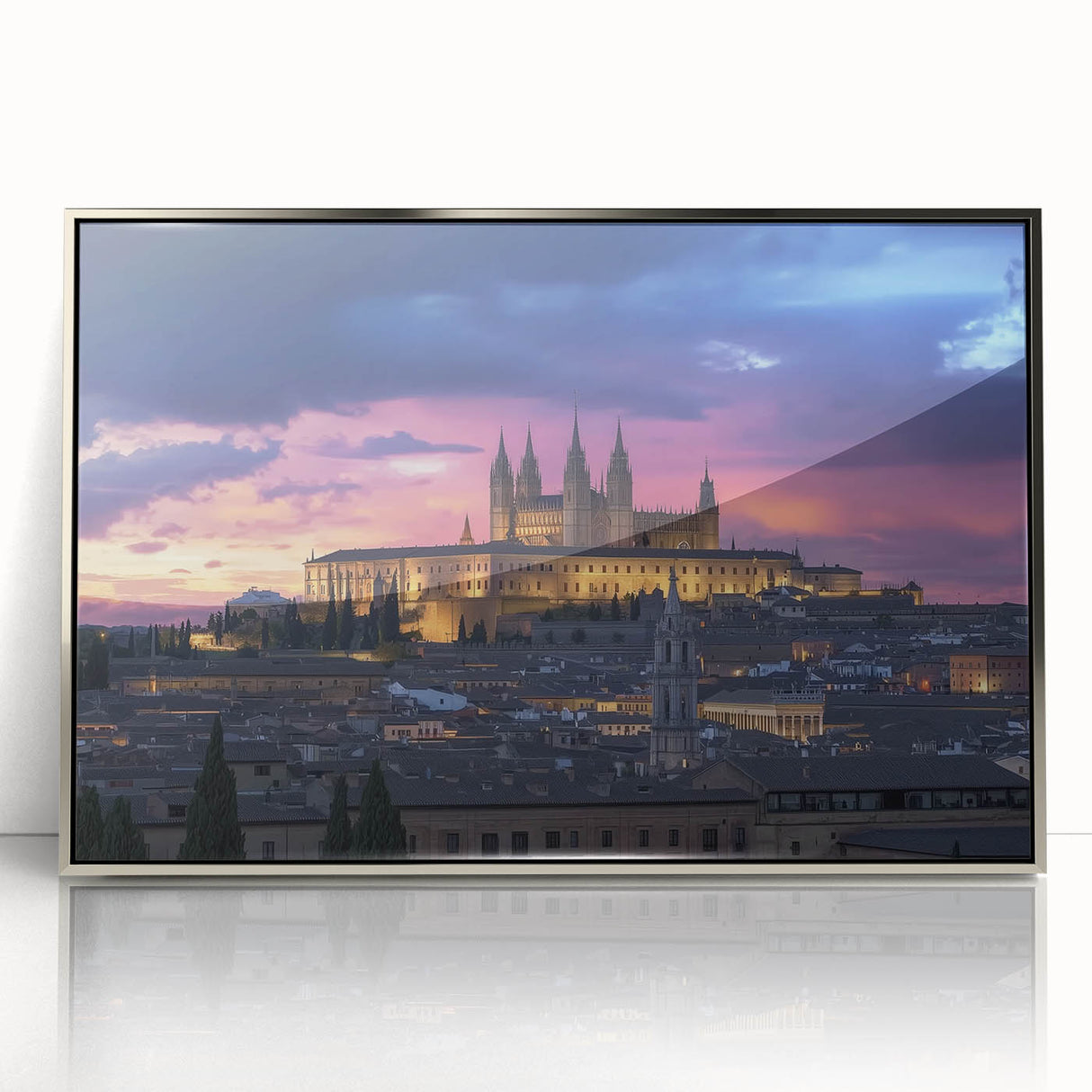 Framed acrylic artwork showcasing a stunning landscape with a historic castle set against a vibrant sunset, elegantly displayed in a silver frame for a sophisticated look.