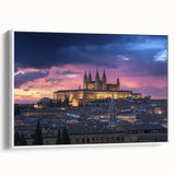 Framed canvas artwork showcasing a picturesque landscape with a majestic castle, set against a serene backdrop of rolling hills and a clear blue sky, ideal for home decor.