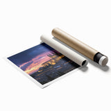 Scenic rolled print showcasing a vibrant landscape with a majestic castle against a sunset backdrop, securely packaged in a durable cardboard tube, ideal for home decor.