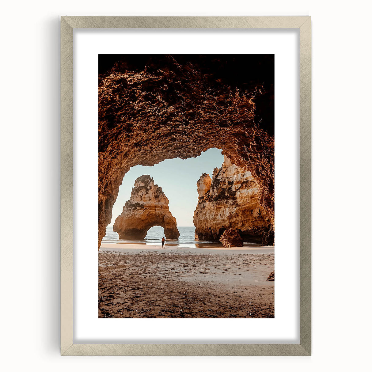 Framed silver landscape artwork depicting a serene cave scene, featuring a textured mat, ideal for home decor. Perfect for nature lovers and art enthusiasts alike.