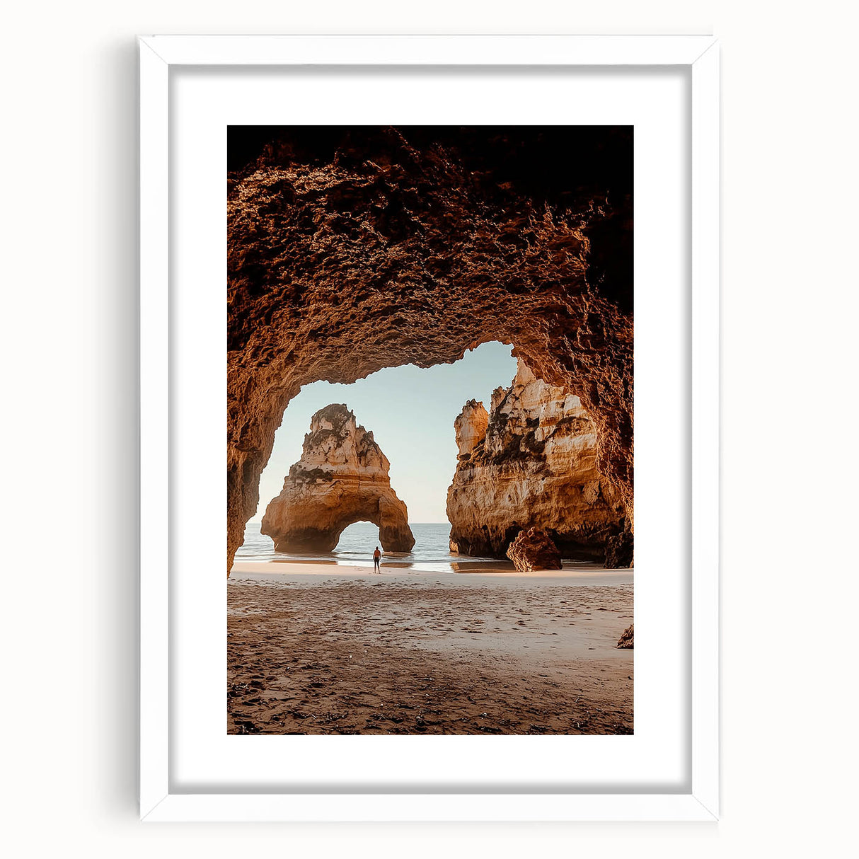 Framed landscape artwork depicting a serene cave scene with vibrant colors, set within a white mat. Ideal for home decor, adding a touch of nature's beauty.