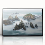 Framed acrylic artwork depicting dramatic cliffs against a vibrant sunset, showcasing deep blues and warm oranges, perfect for modern home decor.