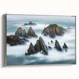 Framed canvas artwork depicting dramatic cliffs in a coastal landscape, showcasing vibrant colors and intricate details, with a sleek silver frame enhancing its elegance. Perfect for modern home decor.