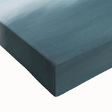 Close-up of a stretched canvas artwork depicting dramatic cliffs and lush landscapes, showcasing vibrant colors and intricate details for an inspiring home decor accent.