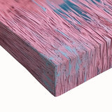 Close-up of a stretched canvas depicting a serene beach landscape at sunset, featuring vibrant colors and intricate details of the waves and sand, perfect for coastal home decor.