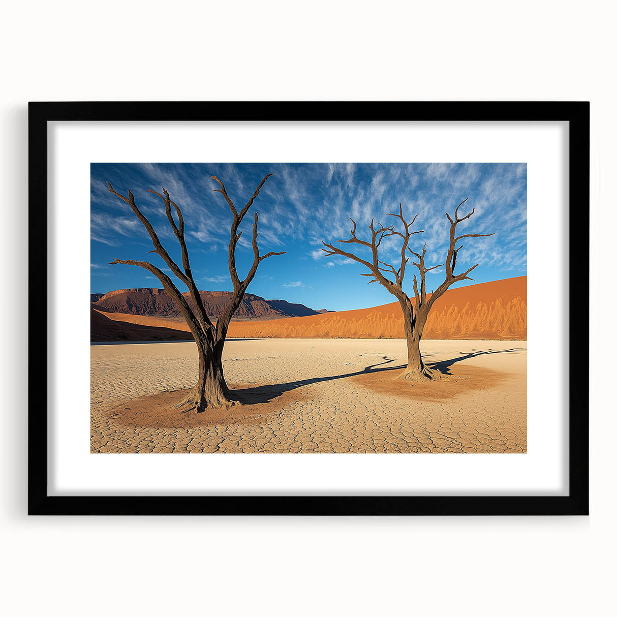 Black-framed landscape artwork depicting a serene desert scene, featuring warm hues of orange and yellow with a textured mat, ideal for home decor enthusiasts.