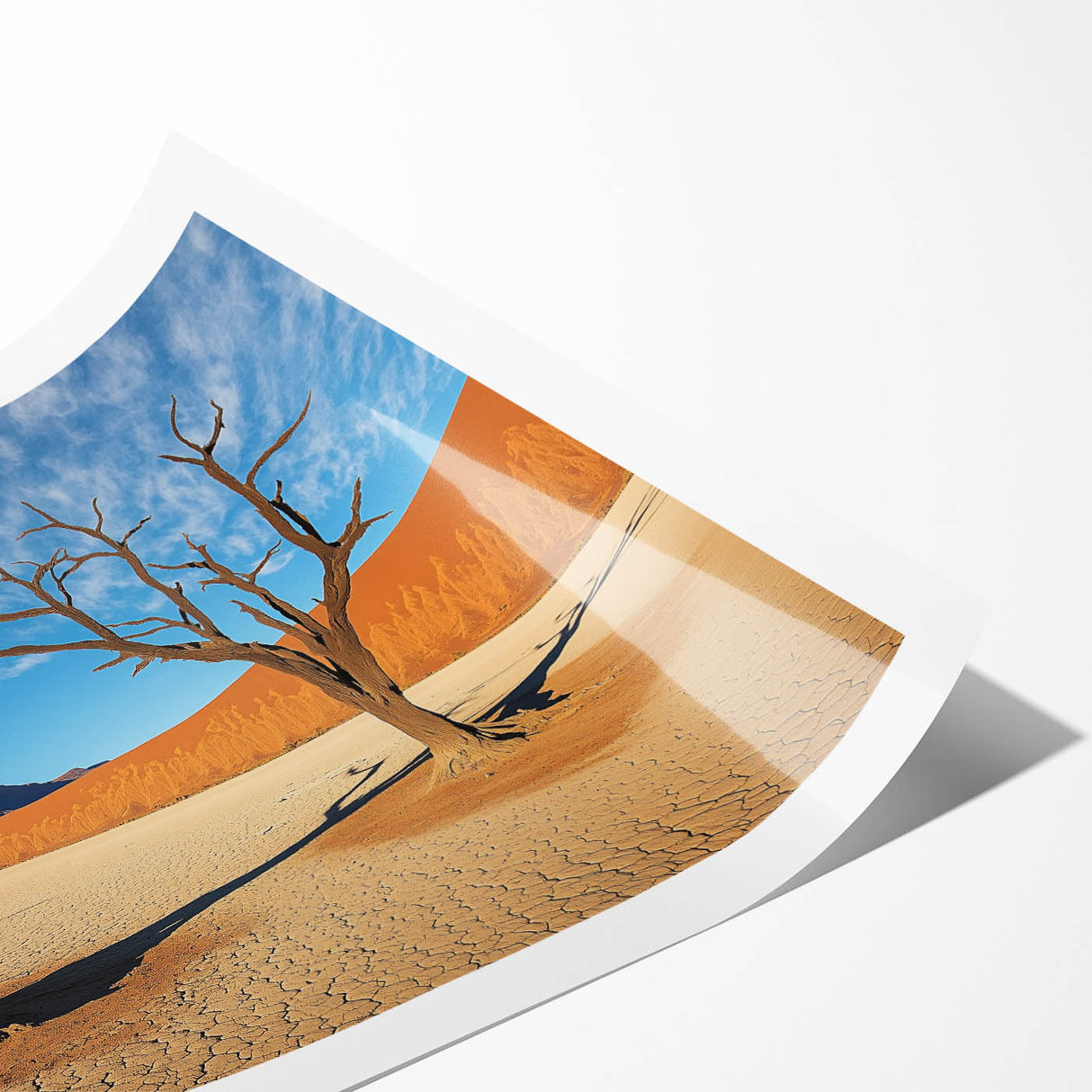 Desert landscape rolled canvas print showcasing vibrant orange and yellow hues, depicting a serene sunset over sand dunes, elegantly packaged in a protective tube.