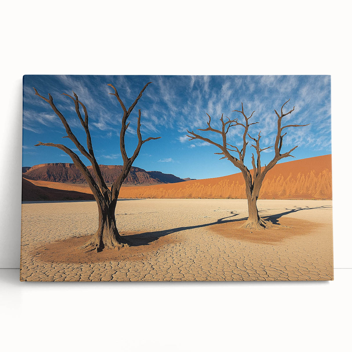 Desert landscape stretched canvas art piece showcasing vibrant orange and yellow hues of a sunset over sand dunes, perfect for modern home decor.