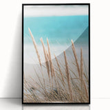 Large abstract wall art on acrylic, featuring swirling blue and orange hues, framed in black.