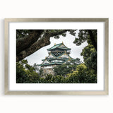 Elegant silver-framed landscape artwork featuring a majestic castle, accented with a white mat for added depth, perfect for home decor or gallery display.