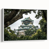 Framed canvas art depicting a picturesque landscape with a majestic castle, showcasing vibrant colors and intricate details. The artwork is set against a white background, enhancing its elegance and modern appeal, perfect for home decor.