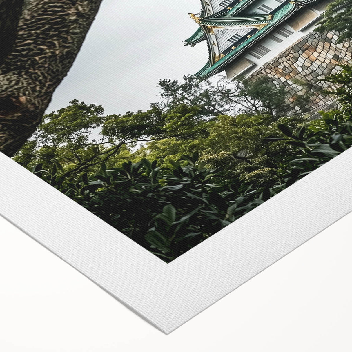 Rolled canvas artwork showcasing a vibrant landscape of a castle surrounded by lush greenery, featuring rich colors and detailed textures, perfect for home decor.
