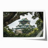 Rolled print showcasing a picturesque landscape with a majestic castle surrounded by lush greenery and vibrant skies, designed for home decor enthusiasts.