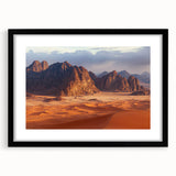 Black-framed landscape wall art featuring dramatic cliffs under a blue sky, with a white mat for an elegant presentation, perfect for home decor.