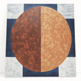 Abstract geometric stretched canvas art piece with vibrant colors, featuring sharp angles and a modern design, leaning against a textured wall for display.