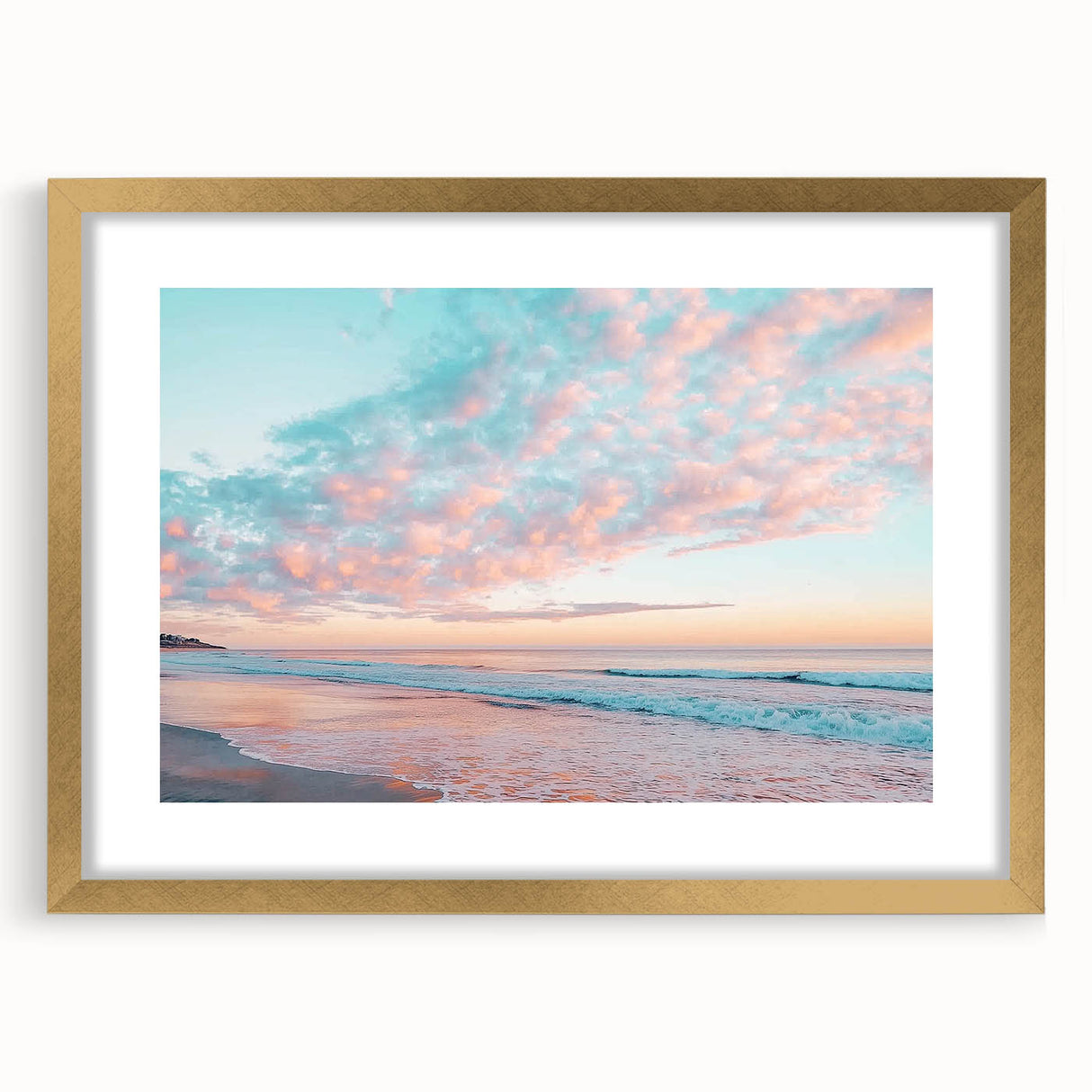 Elegant gold-framed landscape artwork depicting serene beaches at sunset, showcasing soft pastel colors and a stylish mat, perfect for home decor enhancement.