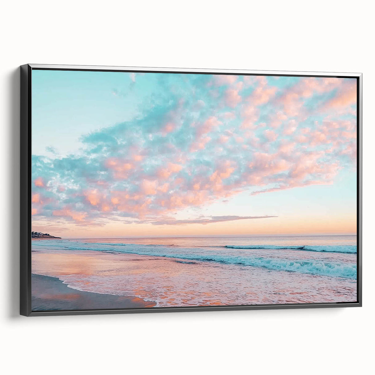 Framed canvas artwork depicting a serene beach landscape with vibrant colors and a black frame, showcasing tranquil waves and a sunset sky, ideal for home decor.