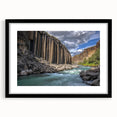 Black-framed landscape print of canyons displayed with a white mat, showcasing vibrant colors and intricate details, perfect for home decor or art enthusiasts.