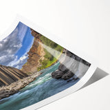 Vibrant rolled print showcasing a stunning landscape of canyons with rich colors and intricate details, ideal for home decor and art enthusiasts, packaged securely for delivery.
