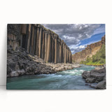 Stretched canvas print showcasing a vibrant landscape of canyons in warm earthy tones, perfect for home decor, adding a natural touch to any interior space.
