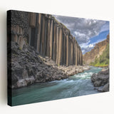 Vibrant landscape canvas print depicting dramatic canyons in rich hues of orange and red, showcasing textured details and an expansive side view, perfect for home decor.