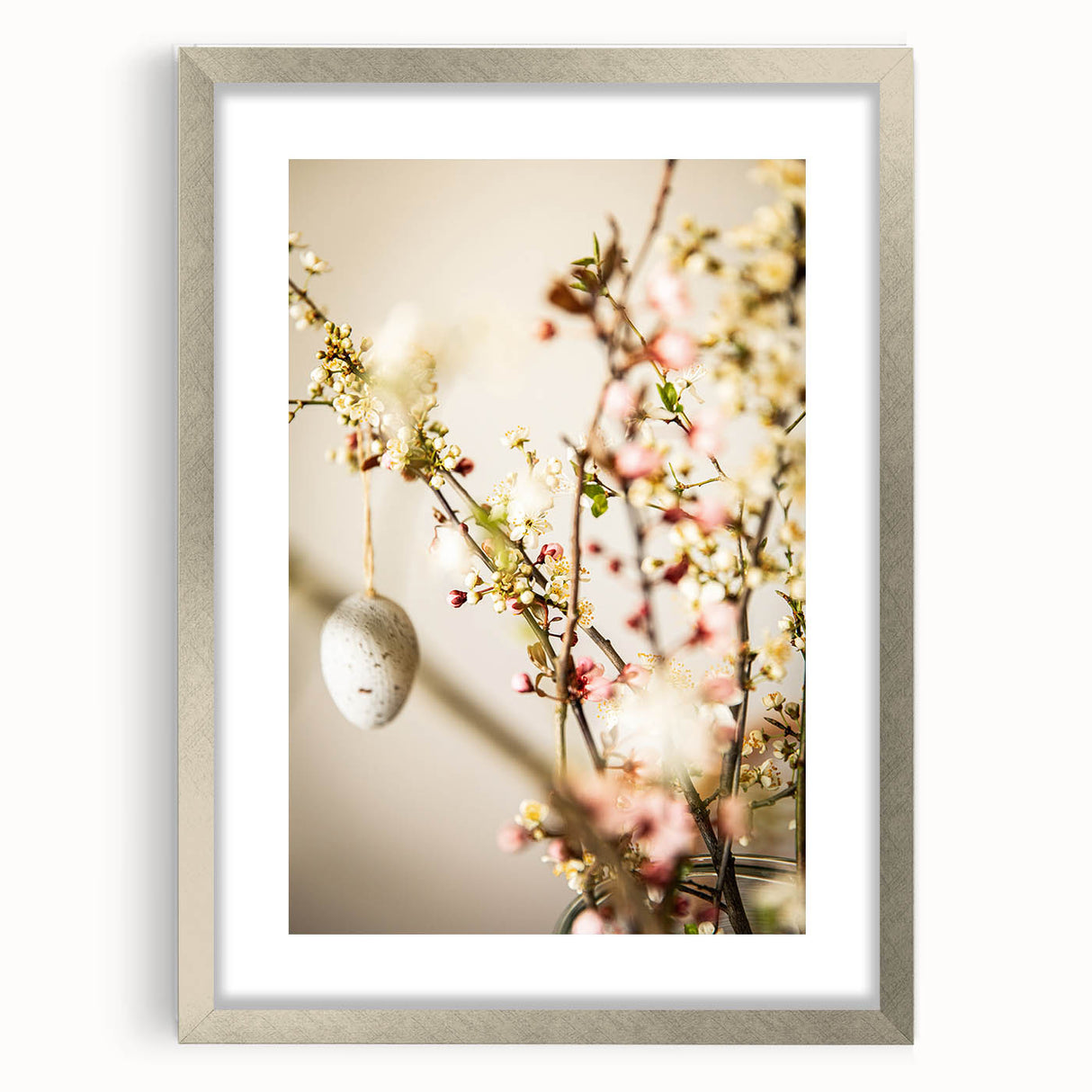 Textured abstract art print in soft green and white, framed in silver, suitable for bedroom decor.