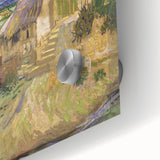 Large abstract wall art featuring swirling blue and yellow patterns on acrylic glass.