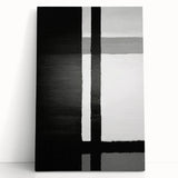 Abstract wall art featuring vibrant strokes in shades of blue, orange, and yellow on a stretched canvas, leaning against a neutral wall, perfect for modern decor.