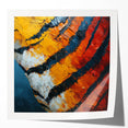 Abstract wall art print showcasing vibrant strokes of blue, orange, and yellow on glossy canvas, ideal for modern home decor or artistic displays.