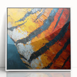 Framed acrylic artwork showcasing an abstract design with dynamic strokes in vibrant colors, set against a sleek white background, perfect for modern decor.