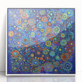 Framed acrylic artwork showcasing an abstract design with vibrant strokes in shades of blue, yellow, and red, perfect for modern home decor.