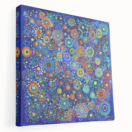Abstract canvas artwork showcasing vibrant strokes in shades of blue, yellow, and pink, stretched on a wooden frame, emphasizing a modern artistic design ideal for contemporary decor.
