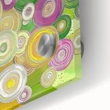 Abstract acrylic strokes in vibrant blue, orange, and green colors create a dynamic close-up view of a glossy glass artwork, showcasing bold textures and fluid patterns ideal for modern home decor.