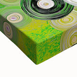 Vibrant abstract strokes on a stretched canvas, showcasing a blend of blue, gold, and green hues. Ideal for modern home decor, adding a lively touch to any space.