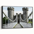 Framed canvas art featuring a picturesque landscape with a majestic castle, set against a serene sky. The black frame complements the vibrant colors, ideal for home decor.