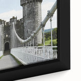 Framed canvas artwork showcasing a detailed landscape of a majestic castle surrounded by lush greenery, ideal for enhancing home decor with a touch of elegance.