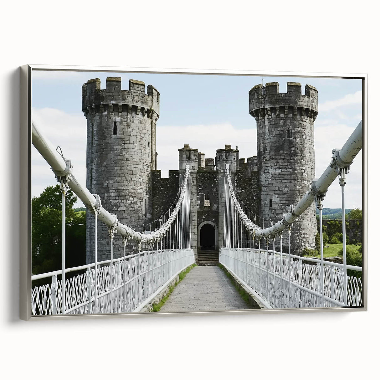 Framed canvas artwork depicting a scenic landscape with a majestic castle, featuring a silver frame and textured surface, ideal for enhancing home decor.