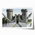 Rolled art print showcasing a picturesque landscape with a majestic castle amidst lush greenery, elegantly packaged in a protective cardboard tube for safe delivery.
