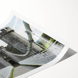 Rolled print showcasing a vibrant landscape featuring a majestic castle surrounded by lush greenery, expertly packaged in a durable cardboard tube for safe shipping.