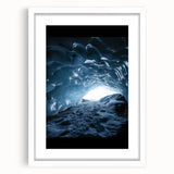 Framed landscape artwork depicting a serene cave scene, featuring earthy tones and intricate details, presented with a white mat for an elegant finish.