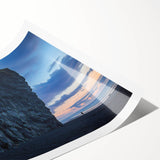 Stunning landscape print depicting majestic cliffs and vibrant blue skies, rolled and ready for display, showcasing intricate details and rich colors. Perfect for enhancing home decor.