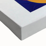 Close-up of an abstract geometric stretched canvas artwork, showcasing vibrant colors and sharp lines, ideal for modern home decor or office spaces.