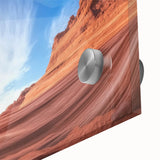 Close-up of an abstract acrylic glass artwork depicting vibrant, layered canyons in rich earth tones, highlighting intricate details and reflections for a modern decor setting.